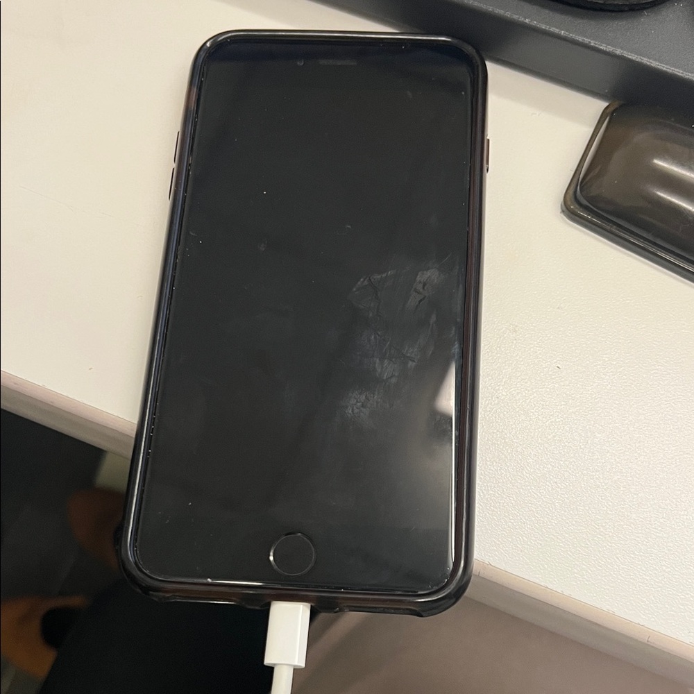 Apple Black Smartphone with White Charger